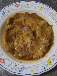 Una foto de Lomo adobado al ajillo con salsa de Vino