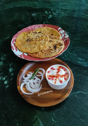 A picture of Aloo paratha with Dahi.