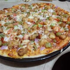 Chicken Tikka pizza A picture of Chicken Tikka pizza.