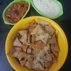 A picture of Leftover Roties Nachos with salsa.