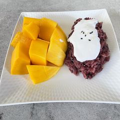 A picture of Mango Coconut Flavored Purple Sticky Rice.