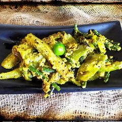 BEYGUN ER JHALBrinjal in coconut and mustard paste A picture of BEYGUN ER JHALBrinjal in coconut and mustard paste.