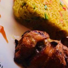 A picture of Fried Rice, grilled chicken.