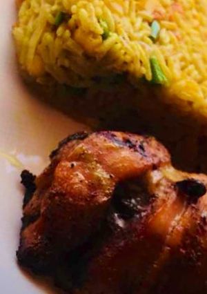 A picture of Fried Rice, grilled chicken.