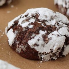 A picture of Chocolate crinkle cookie with buttercream frosting.