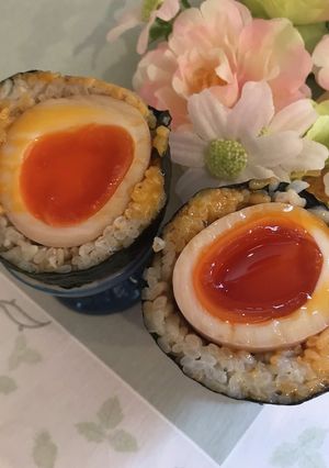 A picture of Scotch Egg-Style Rice Balls with Seasoned Eggs.