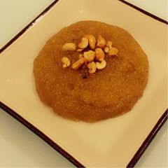 A picture of Orange Kesari(sweet orange dessert).