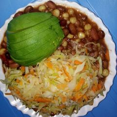 A picture of Stewed githeri with steamed cabbage.