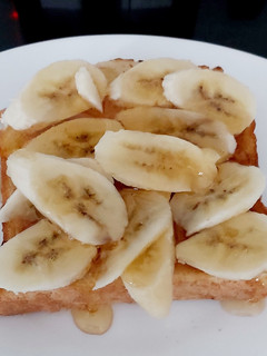 A picture of My French toast with 🍌 and 🍯.