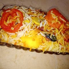 A picture of Chicken and potato biryani.
