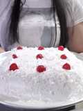 Tres Leches Cake with Whipped Cream, Shredded Coconut, and Cherries