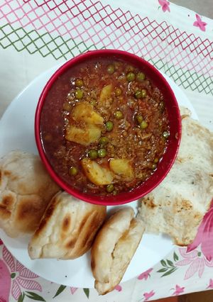 A picture of Mutton mince with potato green peas.
