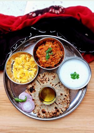 A picture of Baigan no bharta/ringan no olo and bajri no rotla.