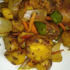 A picture of Oven grilled potatoes n chicken.