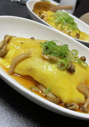 A picture of *Savory Mushroom Japanese-Style Omurice with Dashi Gravy.