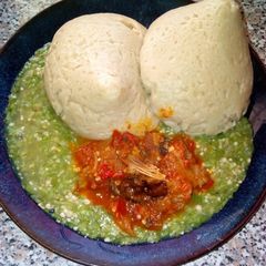 A picture of Tuwon alkama with okro and sauce.