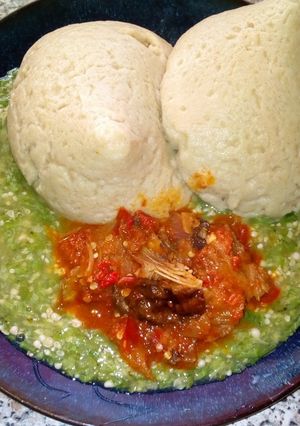 A picture of Tuwon alkama with okro and sauce.