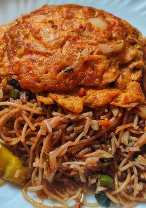 A picture of Triple Schezwan fried rice.