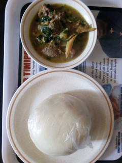 A picture of White soup and pounded yam.