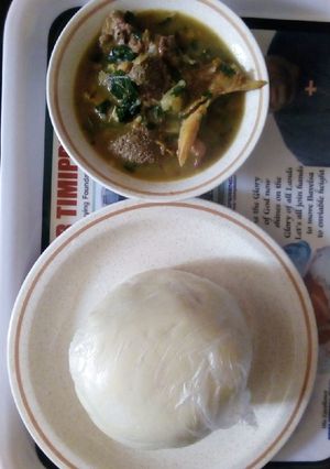 A picture of White soup and pounded yam.