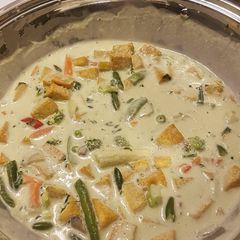 A picture of Vegan green coconut curry.