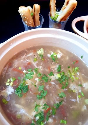 A picture of Shangrila soup with bread sticks.