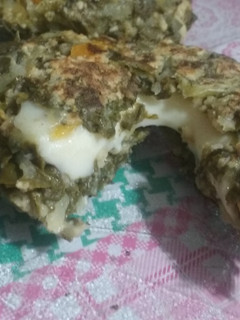 Una foto de Bocaditos de acelga rellenos de queso