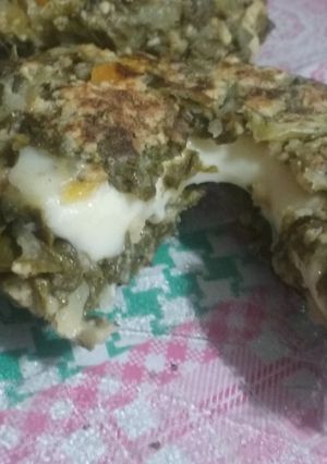 Una foto de Bocaditos de acelga rellenos de queso