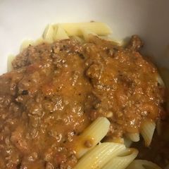 A picture of Vodka sauce with beef and bacon.