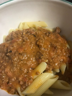 A picture of Vodka sauce with beef and bacon.
