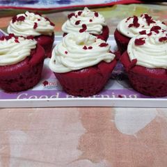 A picture of Red velvet cupcake with a cream cheese frosting.