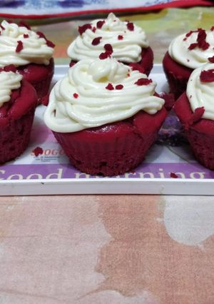 A picture of Red velvet cupcake with a cream cheese frosting.