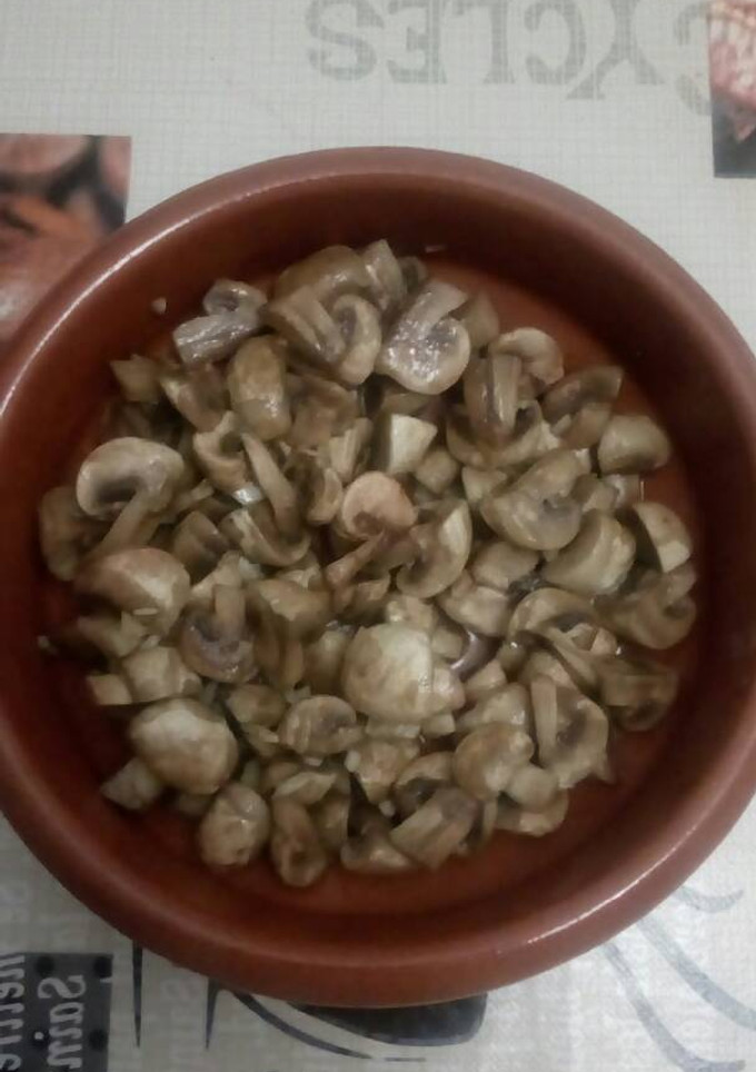 Una foto de Champiñones ajito