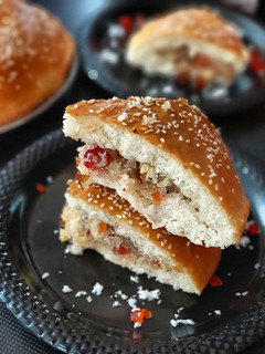 A picture of Dilkush or sweet bread with coconut and tutti frutti filling.