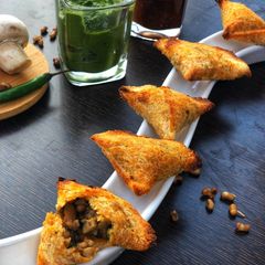 A picture of Mushroom sprouts mini samosas.