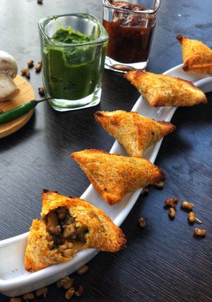A picture of Mushroom sprouts mini samosas.