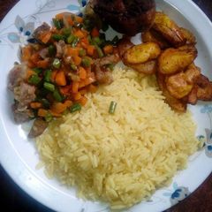 Curry Rice with little veggies on the side A picture of Curry Rice with little veggies on the side.