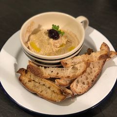 A picture of Homemade taramasalata with toasted sourdough breadsticks.