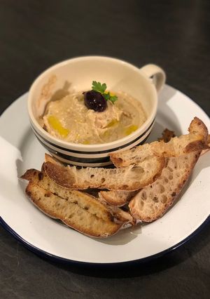 A picture of Homemade taramasalata with toasted sourdough breadsticks.
