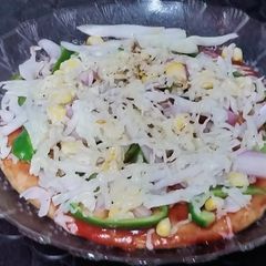 A picture of Thin crust wheat flour pizza base and yummy pizza.