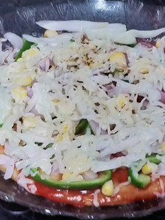 A picture of Thin crust wheat flour pizza base and yummy pizza.