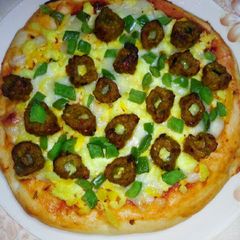 A picture of Mini sikh kabab pizza.
