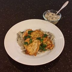 A picture of Chicken Schnitzel with a Creamy Mushroom Sauce.