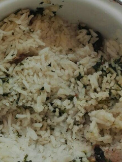 Una foto de Arroz blanco con champiñones y cilantro