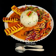 Spicy Grilled Paneer Steak Italian Herb Rice Schezwan Sauce With Exotic Sautéed Veggies Gourmet Meal A picture of Spicy Grilled Paneer Steak Italian Herb Rice Schezwan Sauce With Exotic Sautéed Veggies Gourmet Meal.