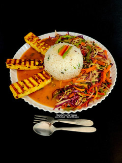 A picture of Spicy Grilled Paneer Steak Italian Herb Rice Schezwan Sauce With Exotic Sautéed Veggies Gourmet Meal.