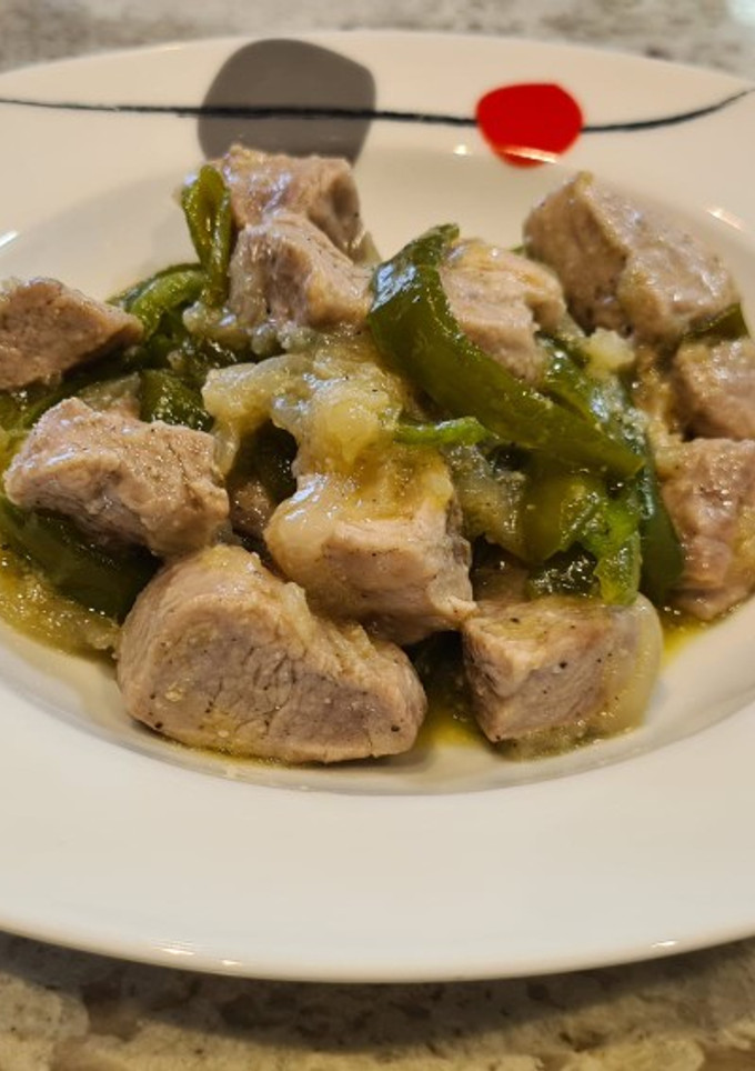 Una foto de Solomillo de cerdo encebollados con pimiento italiano
