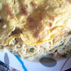 A picture of Indomie Noodles and fried eggs.