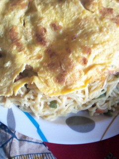A picture of Indomie Noodles and fried eggs.