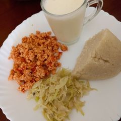 Ugali cabbage and fried eggs A picture of Ugali cabbage and fried eggs.